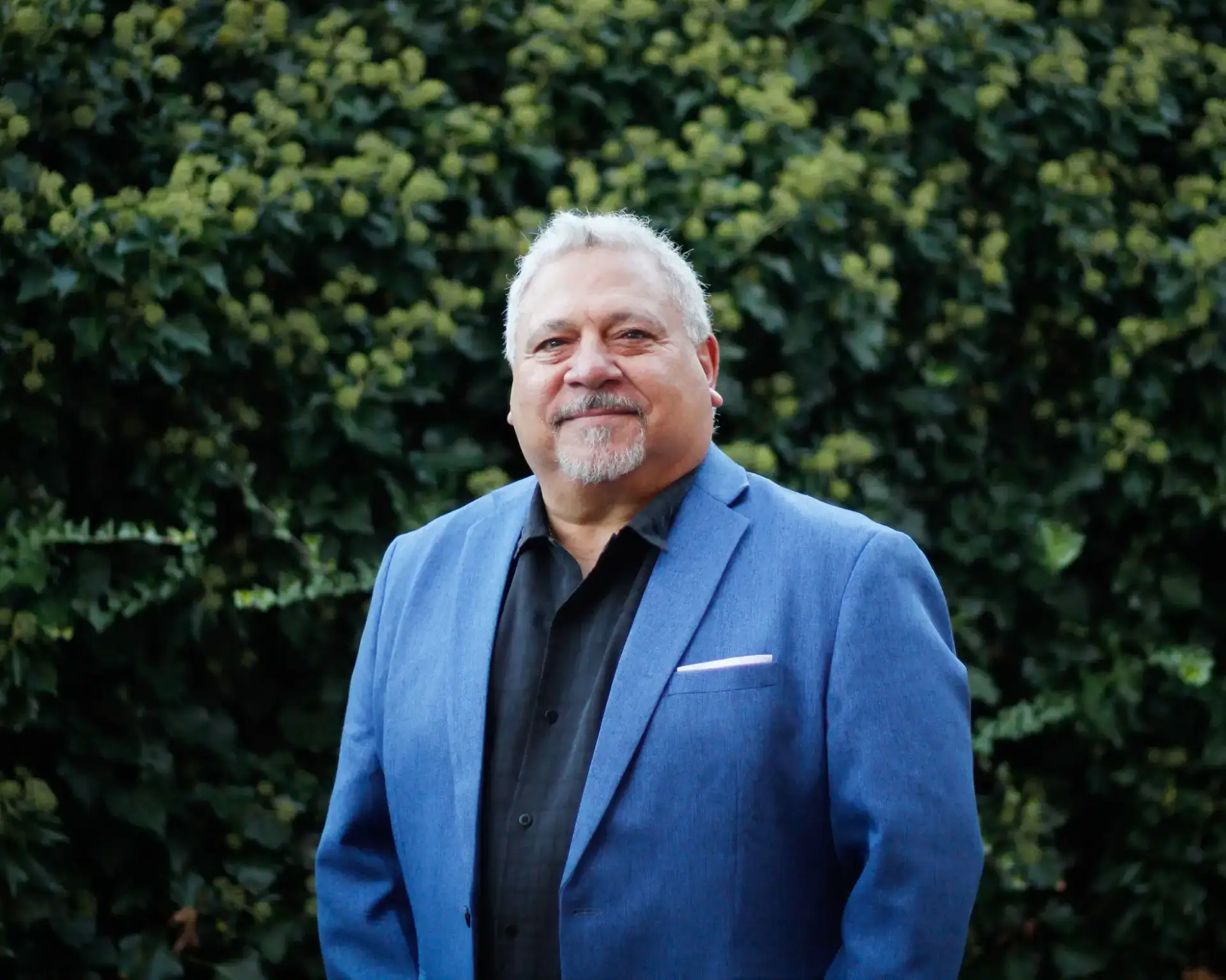 Professional headshot for Senior Project Manager Ray Raimondi, background is an ivy wall.