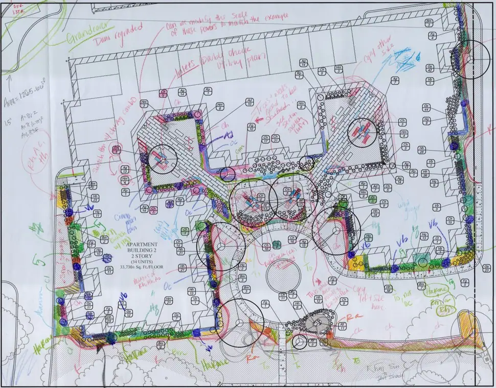 Annotated landscape and site design plan with handwritten markups showing layout adjustments, plantings, and construction notes by Costich Engineering.