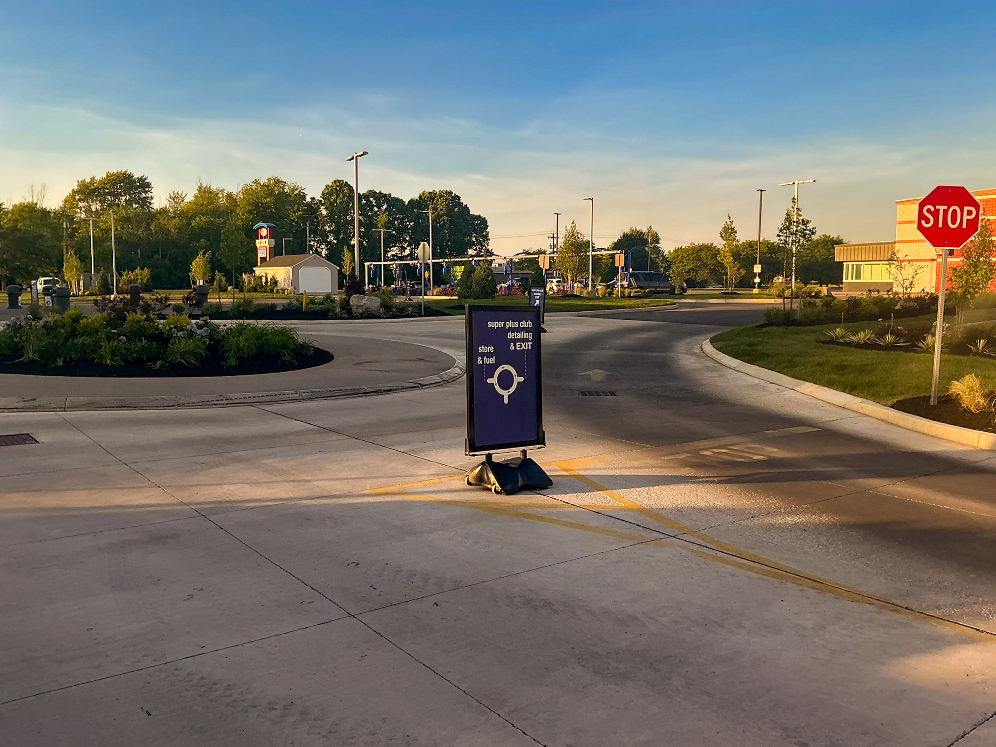 Delta Sonic West Henrietta full site view showing improved circulation layout, wayfinding signage, landscape design, and clear traffic flow patterns.
