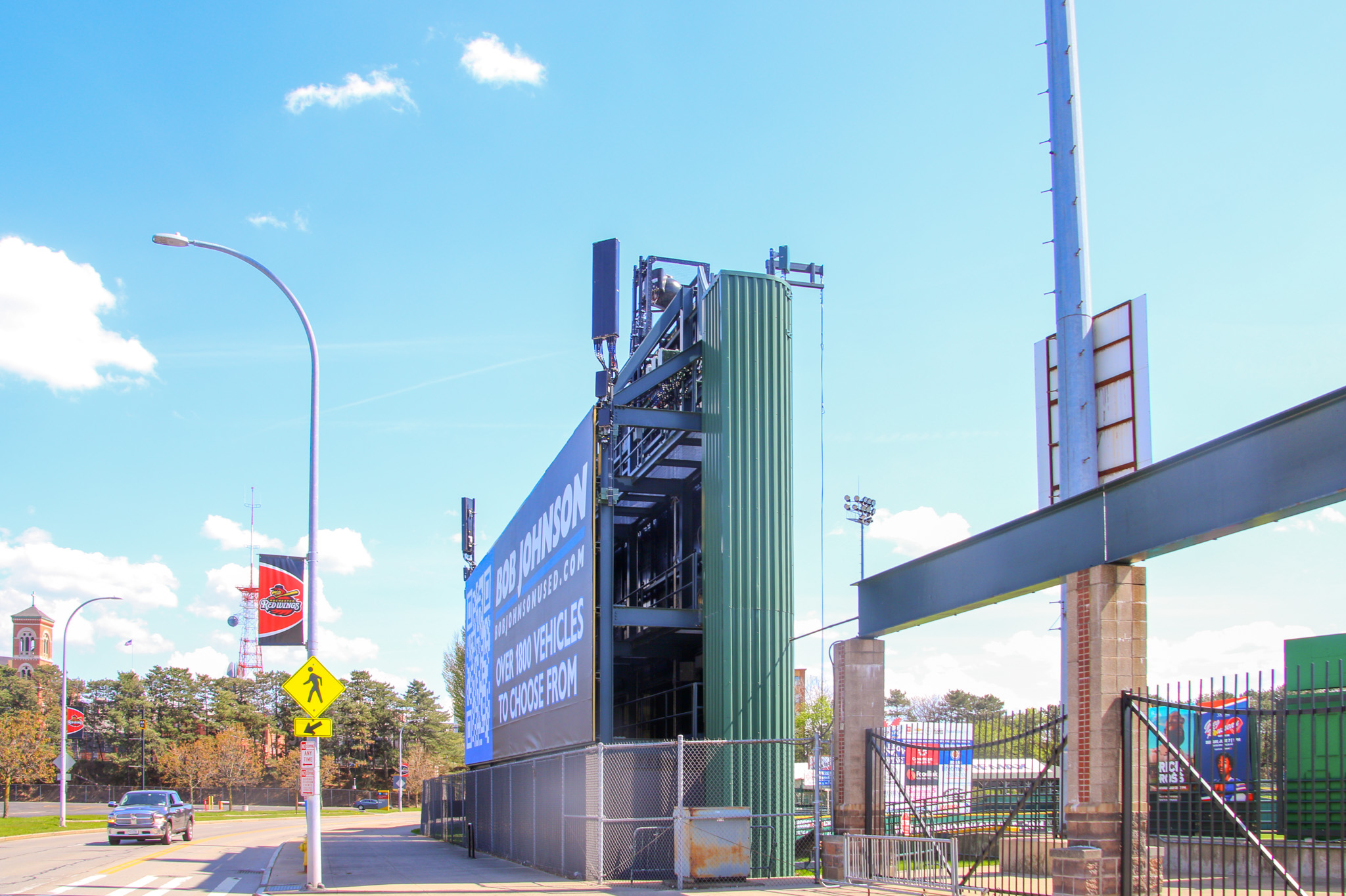 Street-level view of the ESL Ballpark video board and wireless equipment structure near the stadium entrance in Rochester, NY